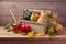 Autumn nature composition. Fall fruits, pumpkin and honey on wooden table
