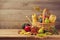 Autumn nature concept. Fall fruits and pumpkin on wooden table. Thanksgiving dinner