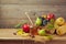 Autumn nature concept. Fall fruits and pumpkin on wooden table. Thanksgiving dinner