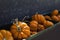 Autumn orange mini pumpkins in antique bin at the orchard.