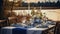 Autumn outdoor dinner table on a riverbank, with a simple wooden table and folding chairs