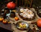 Autumn outdoor still life with homemade pumpkin cinnamon buns in oval glass dish
