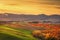 Autumn, panorama in Tuscany, rolling hills, woods and fields on