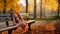 Autumn park, a forgotten warm checkered blanket lies on a bench. Romantic scene without people