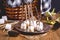 Autumn Picnic Food Concept Toasted Marshmellow on Sticks Wooden Background Plate Cones Wicker Picnic Basket Blanket Toned