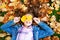 Autumn portrait of adorable smiling little girl child preteen lying in leaves in the park