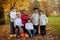 Autumn portrait of group of happy kids, outdoor