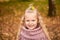 Autumn portrait of pretty little girl. happy child smiles and rejoices