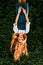 Autumn portrait redhead girl upside down with wild grape wall