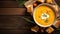 Autumn pumpkin cream soup with rosemary herb and croutons