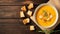 Autumn pumpkin cream soup with rosemary herb and croutons