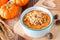 Autumn pumpkin oatmeal with walnuts, chocolate and peanut butter chips