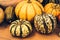 Autumn Pumpkin Thanksgiving Background - orange pumpkins over rusty background. Pile of warty Halloween