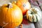 Autumn pumpkins on wooden boards