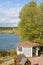 Autumn river forest landscape with pergola and yellow birch