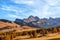 Autumn rolling hills of Seiser Alm plateau and Langkofel Group mountains range. South Tyrol, Italy