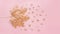 Autumn rose gold maple leaf with elements crumbs on pastel pink paper background. Minimal creative concept with space for text. To