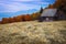Autumn rural scenery and rickety wooden hut on the glade