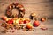 Autumn rustic decorations on wooden table. Natural Fall Thanksgiving harvest decorations. Happy Fallidays! Autumn leaves, pumpkins