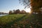 Autumn in Saint-Petersburg, beautiful city park near the lake. Autumn landscape of sunny park under sunshine.