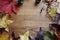 Autumn scene copy space and frame leaves cones conkers on a wooden background