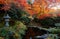 Autumn scenery of beautiful maple trees in a peaceful ambiance with a traditional stone lantern