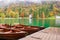 Autumn scenery with boats moored on Bled lake, Slovenia