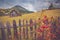Autumn scenery landscape with colorful forest, wood fences, rosehip and hay barns in Bucovina