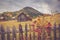 Autumn scenery landscape with colorful forest, wood fences, rosehip and hay barns in Bucovina