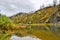 Autumn Scenic Landscape on the rocky steep bank of mountain river