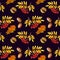 Autumn seamless pattern with yellow leaves, acorns and rowan berries on a black backgoun d.