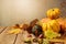 Autumn season background with fall leaves and pumpkin on wooden table