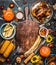 Autumn seasonal cooking and eating background with cutting board, roasted organic harvest vegetables , pumpkin, whole turkey or ch