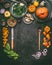 Autumn seasonal food, eating and cooking background with pumpkin. Dark rustic kitchen table with tools