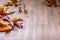 Autumn. Seasonal photo. Autumn leaves loose on a wooden board. Free space for your text products and informations