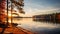 Autumn Serenity: A Tranquil Scene Of A Pine-encircled Lake