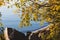 Autumn shore near the water near the boat