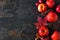 Autumn side border of apples, leaves, and fall decor over a dark stone background