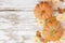 Autumn side border with frosty orange pumpkins on a rustic white wood background