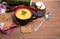 Autumn soup-mashed zucchini and pumpkin on a brown wooden background, sliced zucchini on a wooden cutting Board