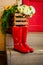 Autumn. Spring.Protection in the rain. red rubber boots on stairs. Street, house entrance. Raindrops. Copy space