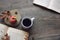 Autumn still life with apple, coffee, open books and leaves over rustic wooden background, copy space, horizontal, aerial view