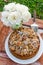 Autumn still life with cake, walnuts and white roses. Rustic style.