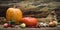 Autumn still life concept with free space for text or congratulations. ripe pumpkins and other fall vegetables and fruits on a