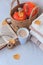 Autumn still life with a cup of coffee, books, pumpkins, autumn leaves, knitted plaids on a white background