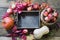 Autumn still life. Fresh fall fruits, ripe apples, pumpkin and wooden tray on table. Copy space.