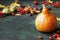 Autumn still life with pumpkin and randomly scattered berries on