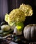 Autumn still life on rustic wooden table with green pumpkins, vase with hydrangea, bowl with seeds, old bottles