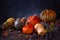 Autumn still life with variety of pumpkins - cucurbita fruits of different colors and sizes with nuts and berries.