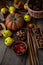 Autumn still life on a wooden table top view. Pumpkin, chestnuts, acorns, quince, nuts, cones. Rustic background. Quince and pear